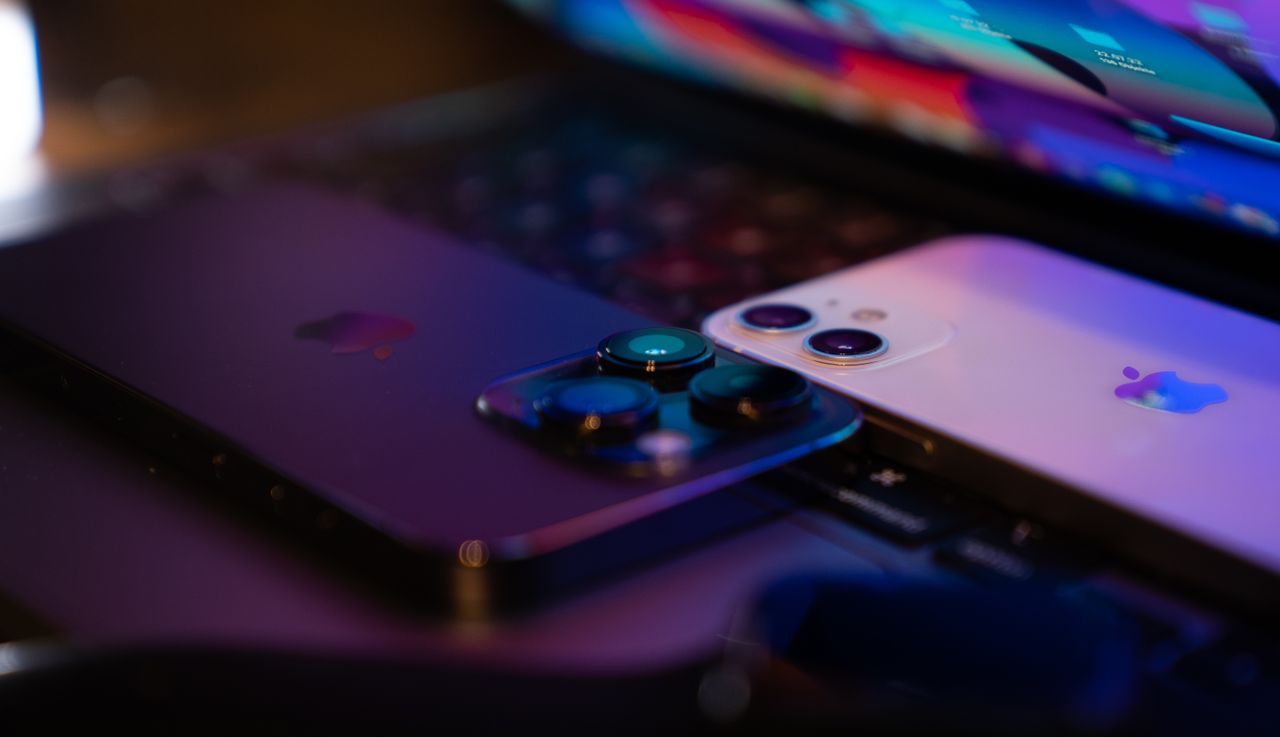Crafting Captivating Headlines: Your awesome post title goes here Close-up image of two modern smartphones placed on a laptop keyboard, highlighting technology design.